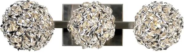 The Snow 3-Light Wall Lamp features distinctive hand-woven aluminum ribbon construction in brushed nickel, creating textured visual interest. At 19 inches wide, it provides ample illumination for vanity or hallway applications.