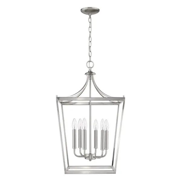 The Kennedy chandelier combines classic candelabra styling with a refined satin nickel finish. At 28 inches tall and 16 inches wide, it's perfectly sized for intimate dining spaces, bedrooms, or entryways seeking understated elegance.