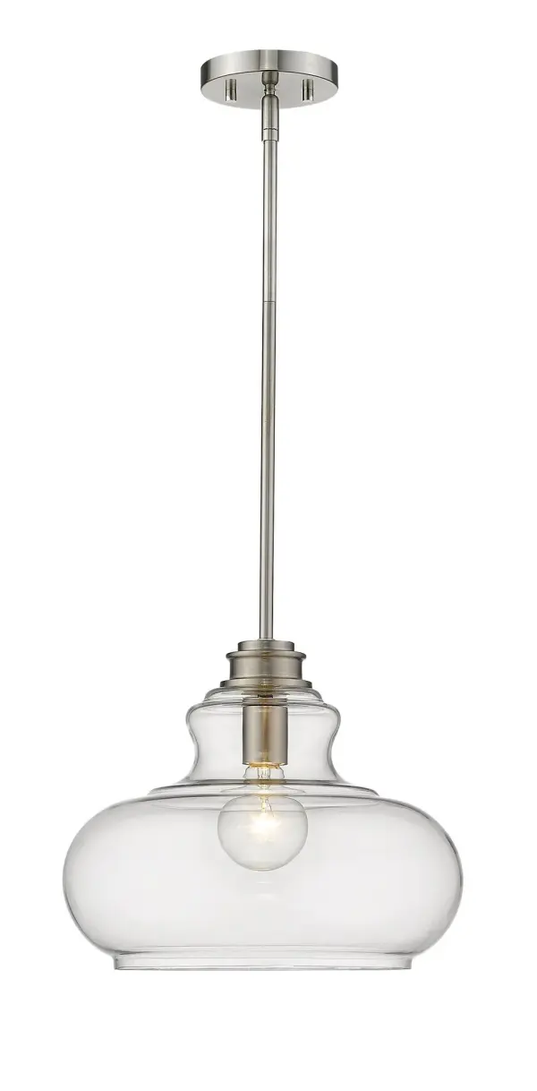 The Torrel pendant combines timeless design with modern versatility. Its clear urn-shaped glass globe and satin nickel finish create a sophisticated look that works beautifully in kitchens, dining areas, and entryways.