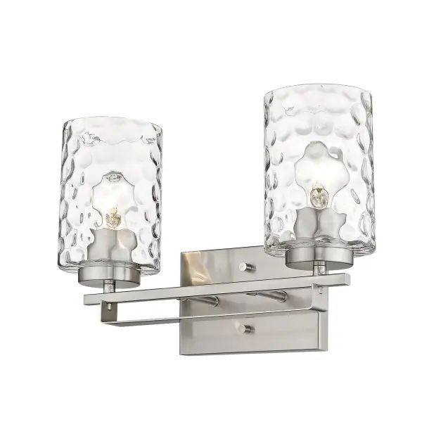 The Livvy 2-Light Vanity combines transitional styling with hand-blown clear optic glass for sophisticated bathroom lighting. Its compact 15-inch width and satin nickel finish make it versatile for various decor styles. - alternate view