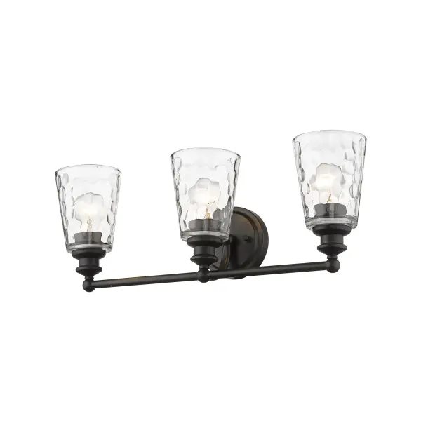 The Mae 3-Light Sconce combines industrial charm with transitional elegance. Featuring hand-blown clear optic glass shades and oil-rubbed bronze finish, this 22.75" wide fixture provides ample illumination for vanities and walls.