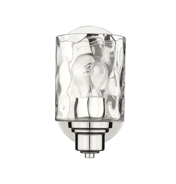 The Lumley bath sconce combines transitional elegance with practical vanity lighting. Its polished nickel finish and hand-blown clear optic glass create sophisticated illumination perfect for bathrooms and powder rooms.