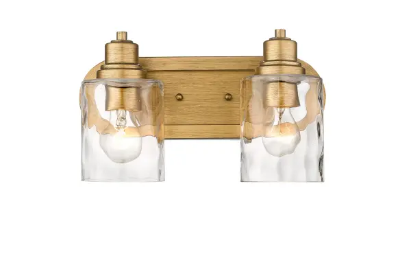 The Lumley 2-Light Bath Sconce combines antique gold steel with hand-blown clear optic glass for a sophisticated vanity lighting solution. Its compact 13.75" width makes it ideal for standard bathroom spaces. - alternate view
