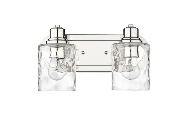 The Lumley 2-Light Bath Sconce combines polished nickel finish with hand-blown clear optic glass for timeless bathroom elegance. Its compact 13.75" width fits most vanity spaces while providing ample illumination. - alternate view