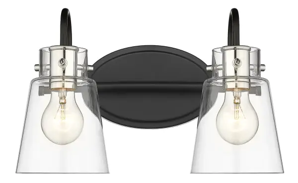 The Bristow 2-Light Wall Light combines matte black steel with polished nickel accents and clear glass shades for an industrial aesthetic. Perfect for bathrooms and powder rooms seeking vintage-inspired style. - alternate view
