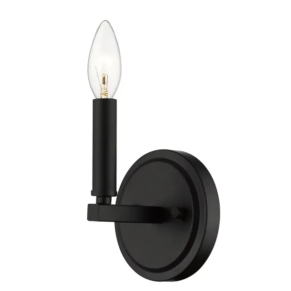 The Sawyer wall sconce delivers industrial charm in a compact 6.6-inch profile. Its matte black steel construction and candelabra socket create versatile ambient lighting perfect for smaller spaces and hallways. - alternate view