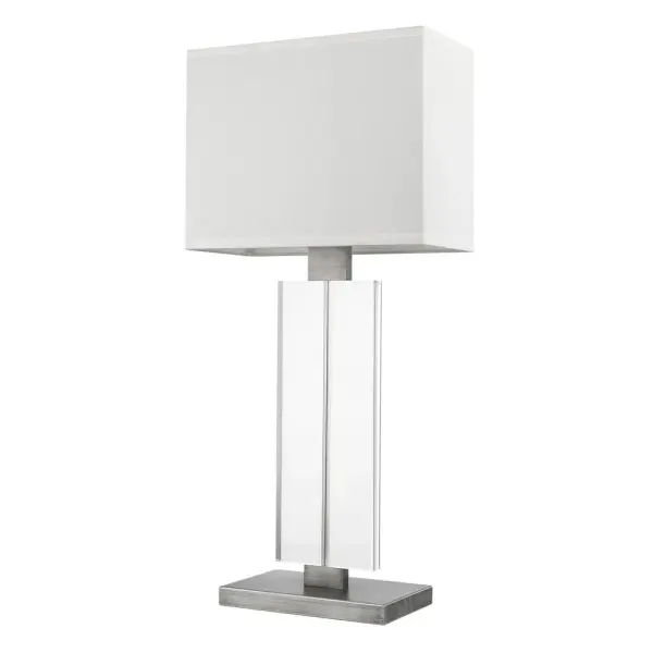 The Shine table lamp combines a sophisticated weathered pewter finish with a classic off-white shantung shade, creating versatile lighting for bedrooms, living spaces, and offices. At 30.75 inches tall, it provides substantial presence.
