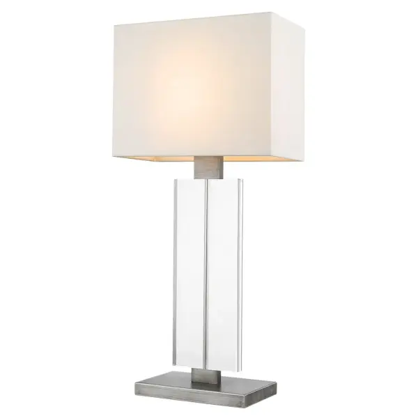 The Shine table lamp combines a sophisticated weathered pewter finish with a classic off-white shantung shade, creating versatile lighting for bedrooms, living spaces, and offices. At 30.75 inches tall, it provides substantial presence. - alternate view