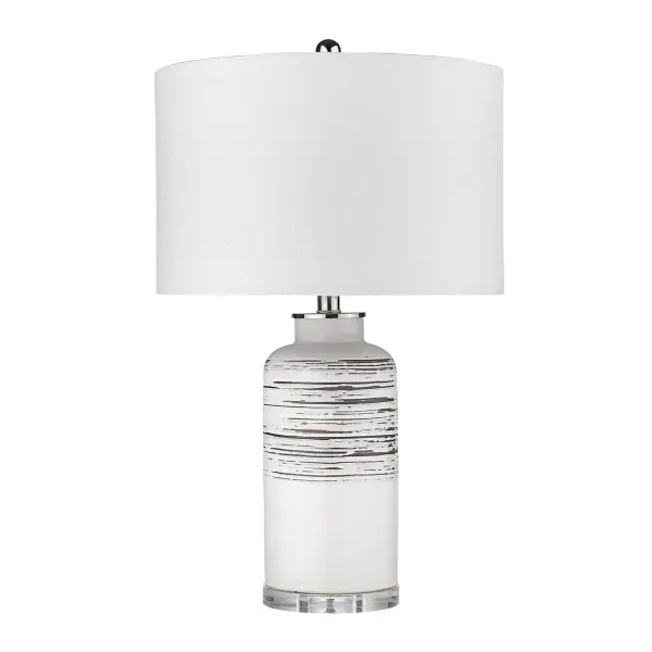 This versatile table lamp combines a polished ceramic base with a neutral seasalt linen drum shade, offering timeless style and functional 3-way lighting. At 24.5 inches tall, it provides ideal task and ambient lighting for bedrooms and living spaces.
