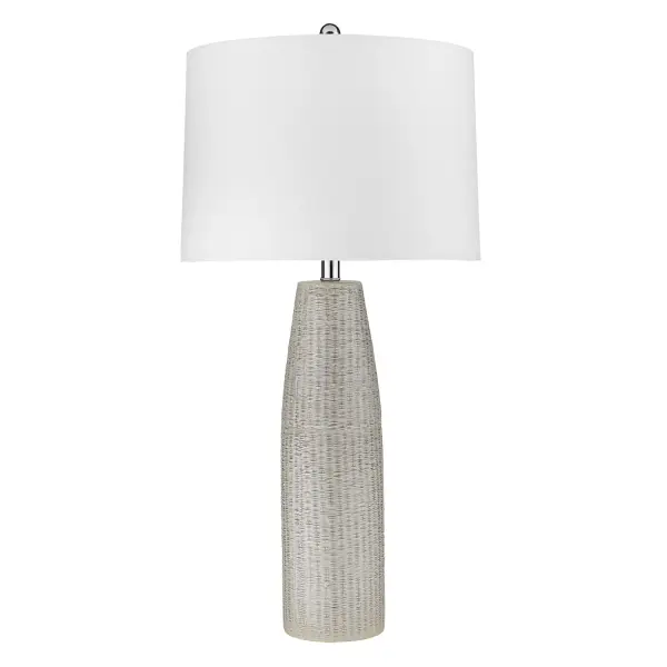 This 32.75" tall table lamp combines a polished nickel ceramic base with a seasalt linen tapered drum shade, creating a sophisticated transitional look. The 3-way rotary switch offers versatile lighting control.