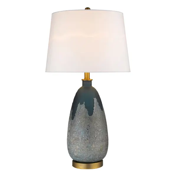 This 30-inch tall table lamp combines a sophisticated brass finish with a glass base and cream linen drum shade. The 3-way rotary switch offers flexible lighting control, while the timeless design complements both traditional and contemporary interiors. - alternate view