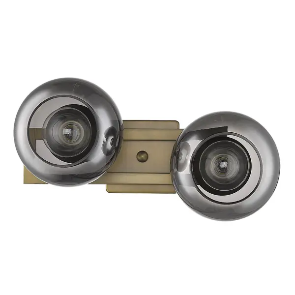 The Lunette 2-Light Sconce combines aged brass finish with smoked glass globes for a refined, contemporary look. At 17 inches wide, it provides substantial illumination while maintaining an elegant profile perfect for vanities and hallways.
