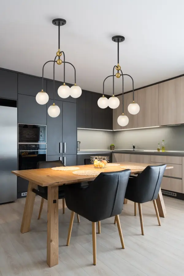 Couplet 4-Light Chandelier in Matte Black with Warm Brass Accents - Image 7