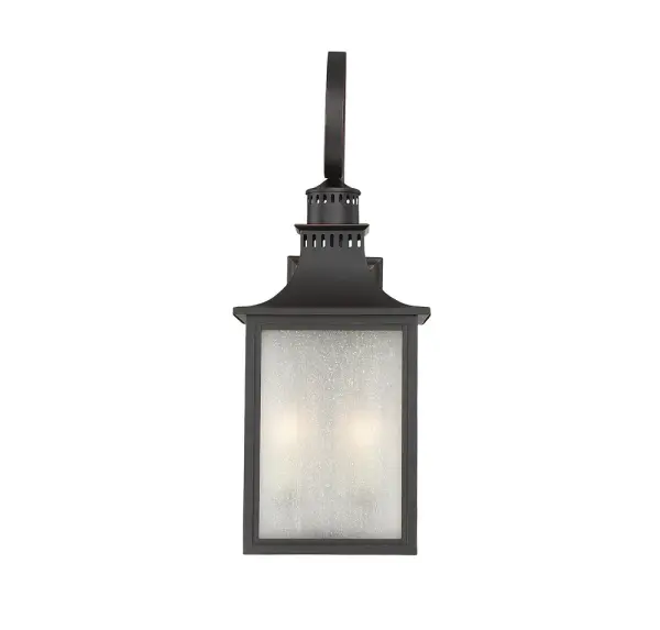 The Monte Grande is an elegant, clean-lined version of a classic, box-shaped lantern. Its a timeless and pleasing style from designer Karyl Pierce Paxton a wall lantern that will not only illuminate the exterior of your home, it will welcome you and your guests with a familiar, traditional aesthetic. The English bronze finish is a wonderful neutral that goes with other hardware and architectural materials. And the panels are made of beautiful, pale cream, seeded glass. Four cream-colored, drip candle covers add to the vintage charm, and hold 40W, C-style bulbs for plenty of soft light. This lantern is 13" wide, 34.5" high, and UL rated for wet locations perfect for the walls of your porch, patio, sunroom, pergola, and other outdoor living areas.