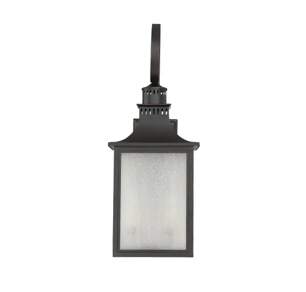 The Monte Grande is an elegant, clean-lined version of a classic, box-shaped lantern. Its a timeless and pleasing style from designer Karyl Pierce Paxton a wall lantern that will not only illuminate the exterior of your home, it will welcome you and your guests with a familiar, traditional aesthetic. The English bronze finish is a wonderful neutral that goes with other hardware and architectural materials. And the panels are made of beautiful, pale cream, seeded glass. Four cream-colored, drip candle covers add to the vintage charm, and hold 40W, C-style bulbs for plenty of soft light. This lantern is 13" wide, 34.5" high, and UL rated for wet locations perfect for the walls of your porch, patio, sunroom, pergola, and other outdoor living areas. - alternate view