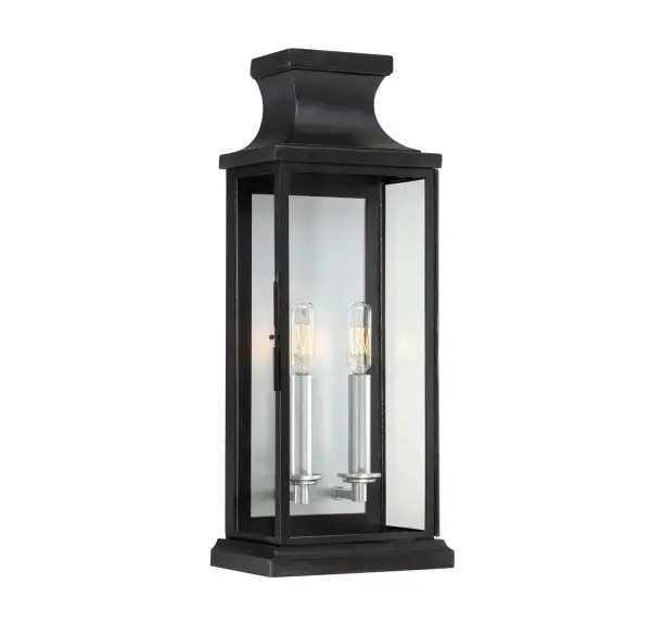 The Brooke wall lantern delivers timeless elegance with its clean-lined rectangular frame, clear glass panels, and sophisticated black finish. Perfect for welcoming guests with warm, traditional charm.
