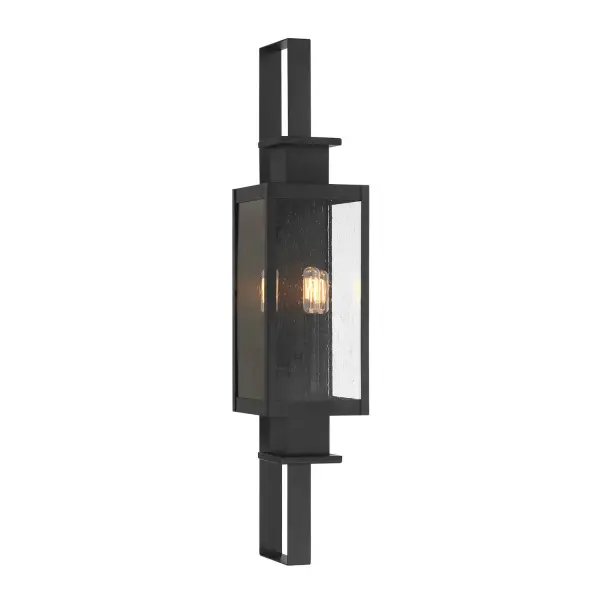 The Ascott outdoor wall lantern delivers striking modern style with its tall, slender profile and sharply angled frame. Clear seeded glass adds texture while the matte black finish provides timeless sophistication for any exterior.