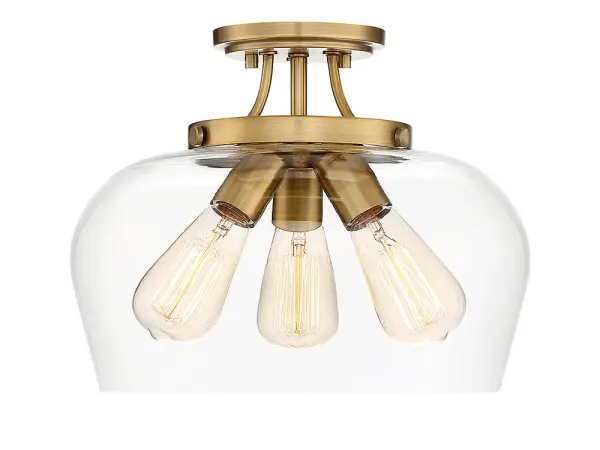 The Octave semi-flush mount delivers understated elegance with its curved clear glass shade and warm brass finish. At 13 inches wide, it's perfectly sized for smaller spaces while providing ample illumination through three bulbs.