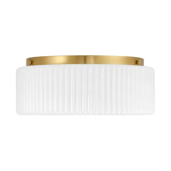 The Edgemont flush mount combines vintage charm with modern versatility. Its ribbed strie glass shade creates eye-catching texture while the warm brass finish complements diverse interiors. At 20 inches wide, it provides substantial illumination for larger spaces without sacrificing ceiling height. - alternate view