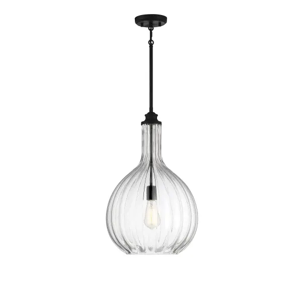 The Brandon pendant combines clean contemporary lines with artisanal glass craftsmanship. Its 14-inch fluted glass shade and matte black finish create visual interest while maintaining versatility across multiple design styles.