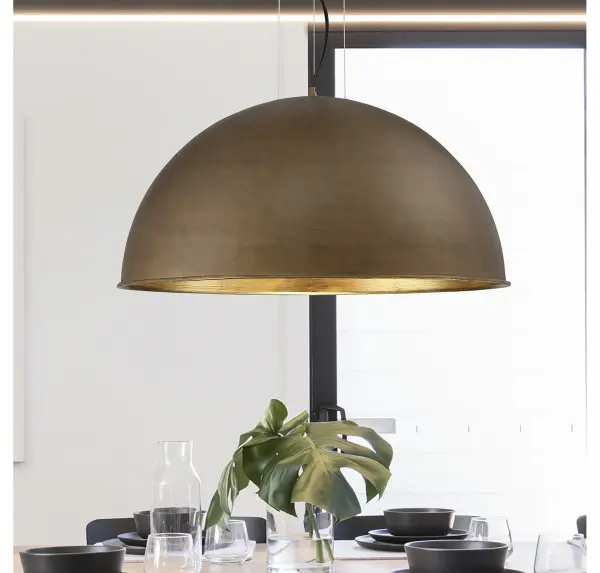 The Sommerton pendant combines clean, spherical design with luxurious dual finishes. The rubbed bronze exterior and gold leaf interior create warm, reflective illumination perfect for transitional and contemporary spaces. - alternate view