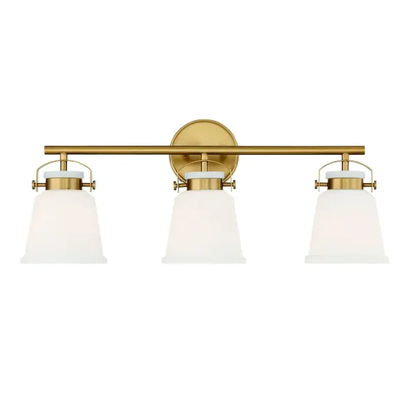 The Kaden 3-light vanity combines timeless design with industrial-inspired hardware in a warm brass finish. White opal glass shades provide even, flattering illumination perfect for bathroom tasks. Damp-rated for reliability.