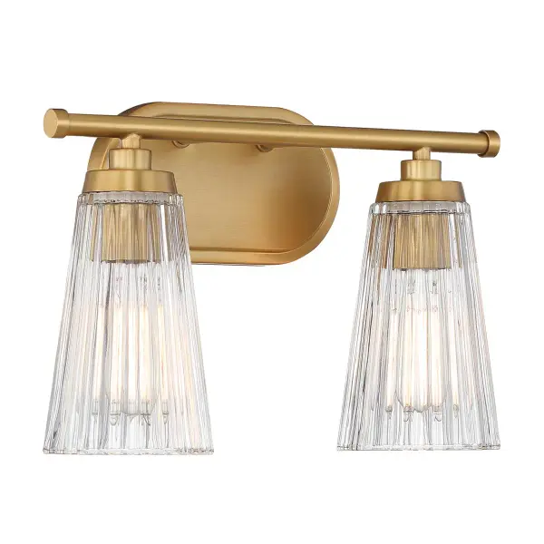 The Chantilly vanity light combines textured clear ribbed glass shades with a warm brass finish for a sophisticated bathroom upgrade. Compact 14-inch width fits most vanity spaces while providing ample illumination. - alternate view