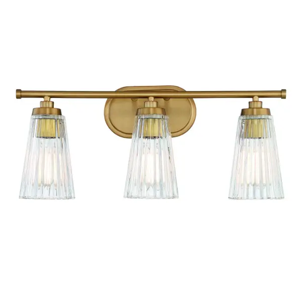 The Chantilly vanity light combines textured clear ribbed glass shades with a sophisticated warm brass finish, creating a refined focal point for bathroom spaces. Its 22-inch width makes it ideal for medium vanities.