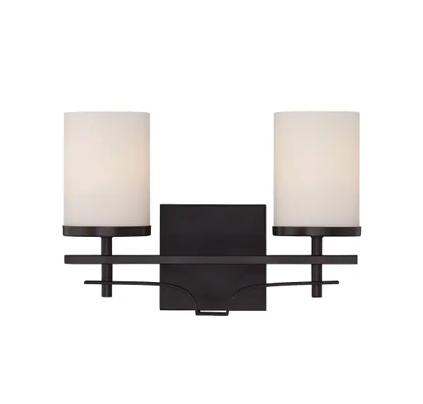 The Colton bath bar combines graceful curved detailing with practical functionality. Its English bronze finish and white opal glass shades create a warm, inviting glow perfect for bathroom vanities.