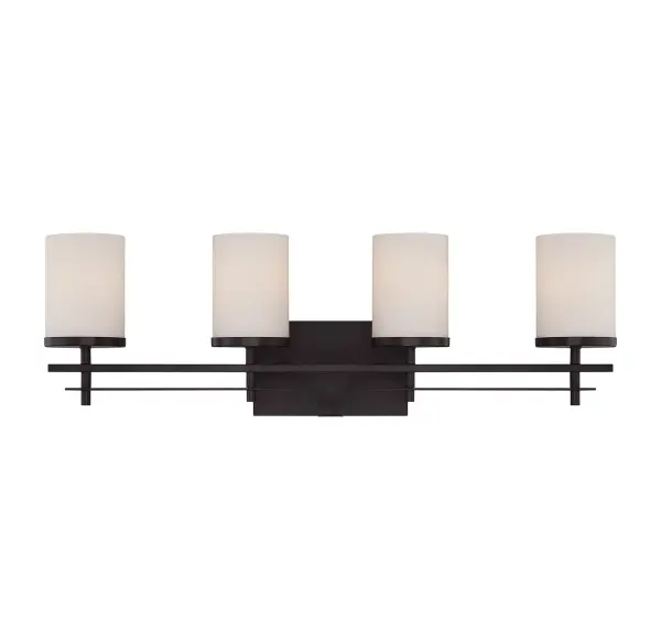 The Colton bath bar combines graceful curved detailing with a rich English bronze finish and white opal glass shades. Its 28.5-inch width makes it ideal for medium to large vanities, delivering flattering, diffused light perfect for grooming tasks.