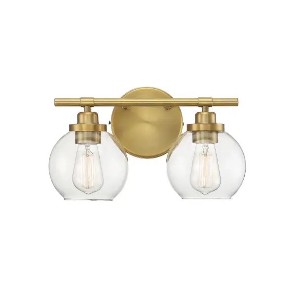 The Carson bath bar combines mid-century modern styling with practical functionality. Its distinctive fishbowl-style clear glass shades and warm brass finish create visual interest while the open-bottom design ensures easy bulb replacement.