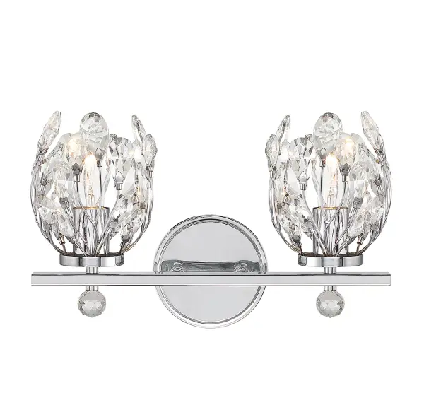 The Moreno vanity light brings a playful botanical aesthetic with crystal buds surrounding each light source. Its compact 15.5-inch width works perfectly over smaller vanities while the chrome finish ensures versatility across design schemes.