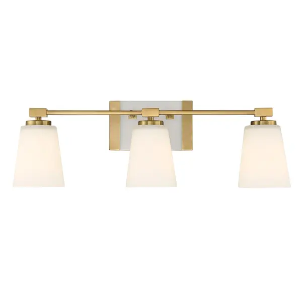 The Darby vanity light brings a serene, spa-like ambiance to bathrooms with its floating white glass design and warm brass finish. The three-light configuration provides excellent task lighting while maintaining a soft, flattering glow.