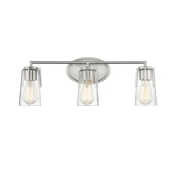 The Sacremento bath bar delivers timeless style with its streamlined satin nickel frame and clear seeded glass shades. At 24 inches wide, it's perfectly sized for standard vanities while providing excellent task lighting for grooming.