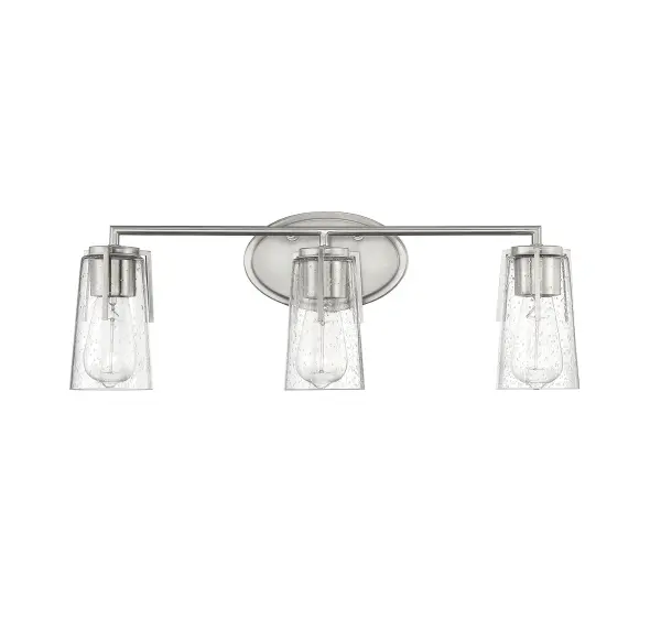 The Sacremento bath bar delivers timeless style with its streamlined satin nickel frame and clear seeded glass shades. At 24 inches wide, it's perfectly sized for standard vanities while providing excellent task lighting for grooming. - alternate view