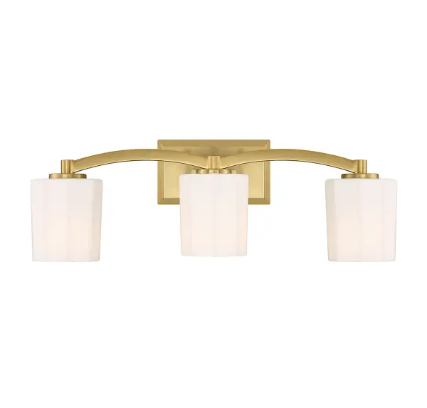 The Whitney 3-light vanity combines understated glamour with practical functionality. Fluted opal etched glass shades provide soft, flattering illumination perfect for grooming tasks, while the warm brass finish adds timeless elegance.