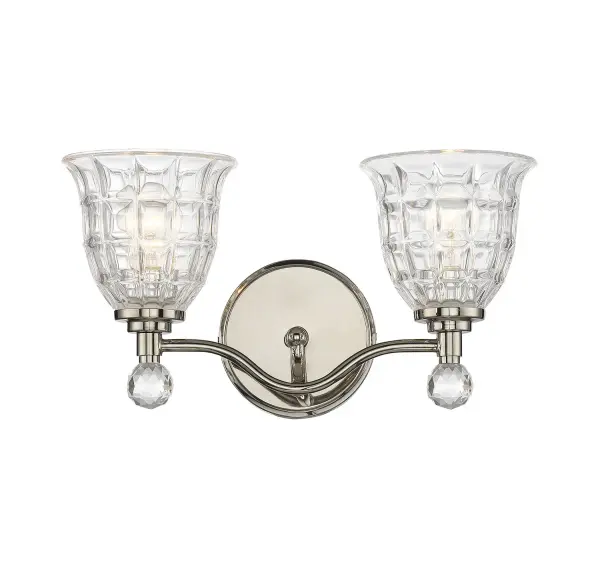 The Birone bath bar combines traditional elegance with practical functionality. Its polished nickel finish, multi-faceted clear glass shades, and crystal globe finial create flattering, luxurious lighting perfect for vanity areas.