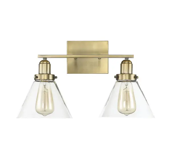 The Drake bath bar combines minimalist design with industrial hardware details and clear glass shades. Its warm brass finish adds sophistication while the exposed bulb design allows for creative styling with Edison bulbs. - alternate view
