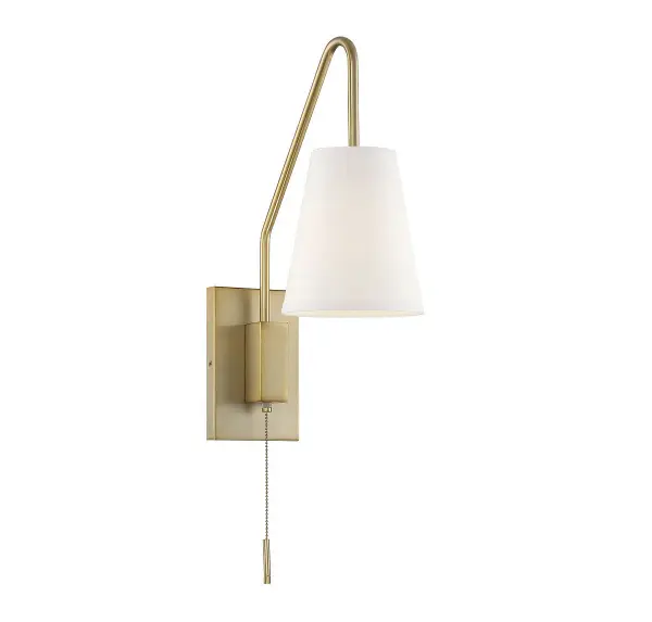 The Owen sconce combines functionality with style through its adjustable swing arm design. The warm brass finish and white fabric shade create a soft, inviting glow perfect for task lighting. Exceptional versatility with both plug-in and hardwire installation options.
