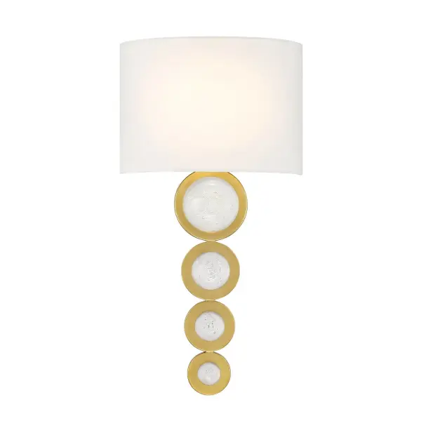 The Marseille sconce brings European sophistication with its curving white fabric shade and warm brass finish. Decorative circular details add textural interest, while integrated LED provides efficient, dimmable illumination.