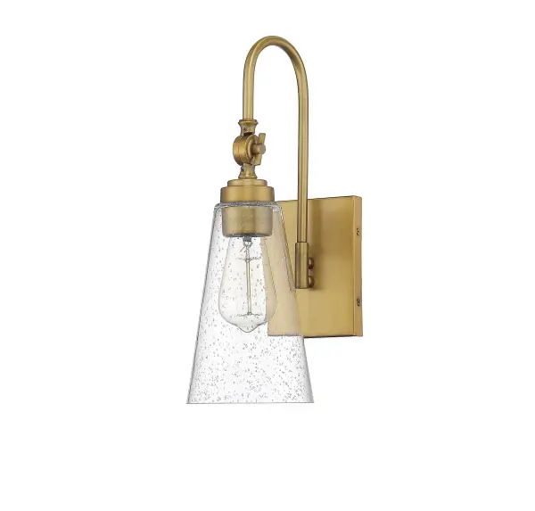 The York wall sconce combines clean lines with warm brass elegance. Its adjustable arm offers flexible lighting direction, while the clear seeded glass shade adds subtle texture and maximizes light output. - alternate view