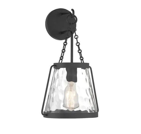 The Crawford wall sconce combines industrial style with classic lantern design. Its matte black finish and clear water glass shade create visual interest while providing functional lighting for various spaces.