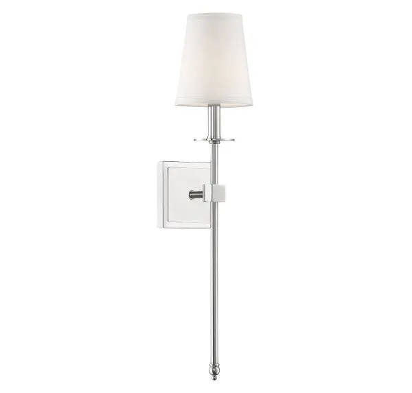 The Monroe sconce combines a clean, elongated silhouette with a soft white fabric shade for versatile wall lighting. Its polished nickel finish and 24-inch height make it ideal for flanking mirrors or illuminating hallways with understated elegance.