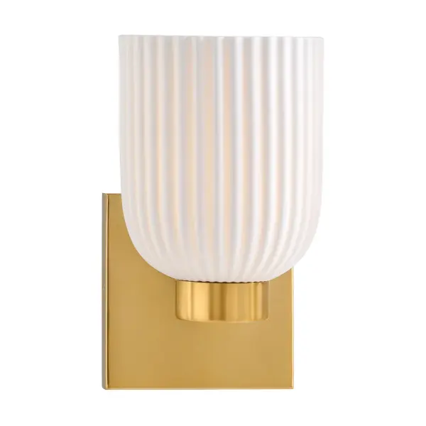 Designed by award-winning interior designer Breegan Jane, this sconce features a beautifully textured translucent porcelain shade that creates a flattering glow when lit and serves as sculptural art when off. The Warm Brass finish adds luxe glamour to any space.