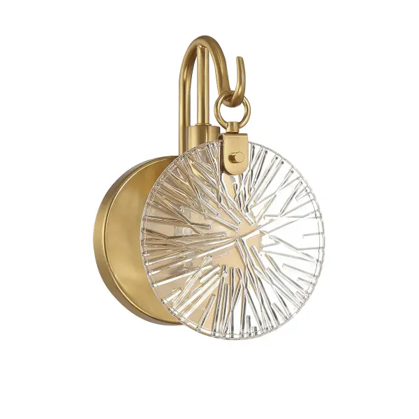 The Addison sconce combines retro charm with modern functionality. Its distinctive hook-style arm and flat starburst glass shade create visual interest, while the warm brass finish adds sophistication to any bathroom or powder room. - alternate view