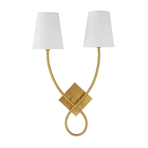The Barclay sconce features distinctive overlapping curved arms that create an eye-catching loop detail. White linen shades provide soft, diffused light while the warm brass finish adds timeless elegance to any space. - alternate view