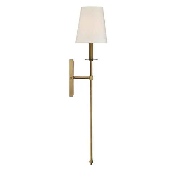 The Monroe wall sconce combines contemporary clean lines with transitional warmth through its elongated silhouette and soft white fabric shade. The warm brass finish adds sophistication while remaining versatile enough to mix with other hardware finishes. - alternate view