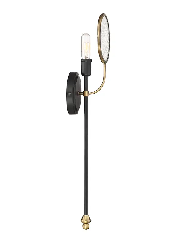 The Oberyn sconce combines modernist design with retro appeal through its vertical light arm, circular seeded glass shade, and sophisticated black-brass finish. A conversation-worthy fixture that works beautifully in intimate spaces.