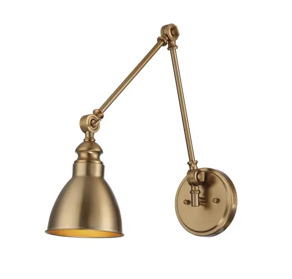 The Dakota wall sconce combines classic styling with modern functionality through its adjustable arm design. The warm brass finish adds a sophisticated touch that works across multiple decor styles, making it ideal for bedside reading or workspace task lighting.