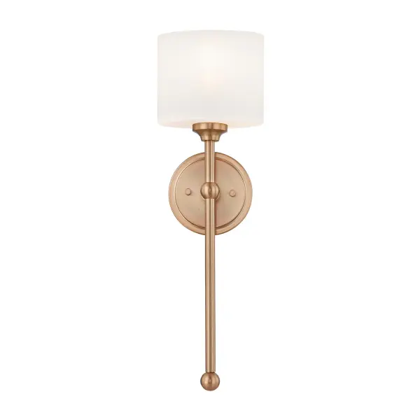 Refined transitional 1-light wall sconce with a tall, slender vertical silhouette that blends classic detailing with contemporary restraint, ADA-compliant design with reduced wall projection, ideal for corridors and high-traffic areas without sacrificing style, Architectural vertical composition draws the eye upward, helping spaces feel taller, lighter, and more composed, Oval opal glass shade delivers soft, even illumination with no harsh glare, creating a calm and welcoming ambient glow, Warm brushed brass finish adds timeless sophistication with a softly muted sheen rather than a high-gloss reflection, Round backplate with subtle stepped detailing provides depth and refinement without unnecessary ornamentation, Clean vertical metal stem creates a tailored, uninterrupted line for a balanced and elegant profile, Spherical accent at the arm junction introduces a jewelry-like detail that enhances visual interest, Rounded finial at the base of the stem visually anchors the design and adds a classic finishing touch, Slim footprint and close-to-wall design feel intentional and elegant, never compromised for ADA requirements, Ideal for hallways, bathrooms, powder rooms, hotel guestrooms, and hospitality public spaces, Produces a soft, flattering wash of light that enhances wall textures and surrounding finishes, Perfect as an accent sconce or installed in pairs for symmetry and architectural rhythm, Transitional styling allows seamless integration into traditional, modern classic, and contemporary interiors, UL rated for damp locations for added versatility, Measures 22" in height for a graceful, elongated presence, Requires (1) medium base (E26) 100W bulb (not included), Dimmable when used with a compatible dimmer, allowing customizable light levels for different moods and settings, Collection: Fusion Finish: Brushed Brass Glass: Opal Glass Width: 6.50" Height: 22.00" Extension from Wall: 4.00" Canopy: 5" Dia x 1" Proj. Number of Bulbs: 1 Maximum Wattage: 100.00 W Bulb Base: E26 Voltage: 120.00 V Safety Rating: Damp ADA